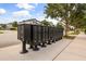View of community mailboxes for residents with sidewalks and landscaping at 9567 Meadow Hunt Way, Winter Garden, FL 34787