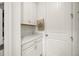 Bright pantry features white cabinets and plenty of countertop space at 9567 Meadow Hunt Way, Winter Garden, FL 34787