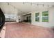 The screened-in patio has a basketball hoop, exercise equipment, dining table, and outdoor access at 9567 Meadow Hunt Way, Winter Garden, FL 34787
