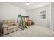 A bright and inviting playroom, featuring a climbing structure and soft seating at 9567 Meadow Hunt Way, Winter Garden, FL 34787