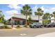 Exterior view of the Starbucks with ample parking and palm trees at 9567 Meadow Hunt Way, Winter Garden, FL 34787
