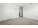 Inviting bedroom with plush carpet and closet access to the Primary bathroom at 9820 Bucklow Hill Dr, Orlando, FL 32832