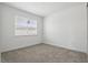Cozy carpeted bedroom featuring a large window with blinds at 9820 Bucklow Hill Dr, Orlando, FL 32832