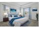 Serene bedroom features a king bed, soft blue accents, and bright windows for a relaxing retreat at 9820 Bucklow Hill Dr, Orlando, FL 32832