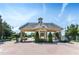 Grand entrance to a gated community with manicured landscaping and a secure entry at 9820 Bucklow Hill Dr, Orlando, FL 32832