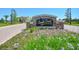 Elegant stone entrance sign for Eagle Creek, surrounded by colorful landscaping at 9820 Bucklow Hill Dr, Orlando, FL 32832