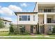 Beautiful townhouse with well-kept landscaping and modern architectural design at 9820 Bucklow Hill Dr, Orlando, FL 32832