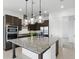 Contemporary kitchen with a granite island, stainless appliances, and ample cabinet space at 9820 Bucklow Hill Dr, Orlando, FL 32832