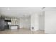 Open-concept living area boasts a kitchen with stainless appliances, dark cabinets, and recessed lighting at 9820 Bucklow Hill Dr, Orlando, FL 32832