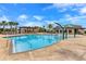 Beautiful community pool area with palm trees, splash pad features, and comfortable lounging spaces at 9820 Bucklow Hill Dr, Orlando, FL 32832