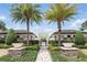 Beautifully landscaped pool entrance with palm trees and inviting walkway at 9820 Bucklow Hill Dr, Orlando, FL 32832