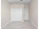 Bedroom features sleek tile flooring, a double door closet and neutral walls at 9885 Montclair Circle Cir, Apopka, FL 32703