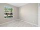 Bedroom with sleek tile flooring, closet and a window with a view at 9885 Montclair Circle Cir, Apopka, FL 32703
