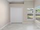 Bedroom with tiled floor, closet and bright windows at 9885 Montclair Circle Cir, Apopka, FL 32703