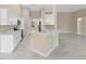 Modern kitchen with stainless steel appliances, white cabinets, and light countertops at 9885 Montclair Circle Cir, Apopka, FL 32703