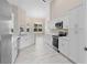 Modern kitchen featuring stainless steel appliances and ample cabinet space at 9885 Montclair Circle Cir, Apopka, FL 32703