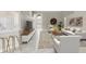 Bright living room with high ceilings, tile floors, modern furnishings, and a view of the entry at 9885 Montclair Circle Cir, Apopka, FL 32703