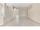 Open-concept living room with neutral paint and tile flooring, bathed in natural light at 9885 Montclair Circle Cir, Apopka, FL 32703