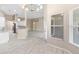 Open-concept living area with a view of the kitchen and lots of natural light at 9885 Montclair Circle Cir, Apopka, FL 32703
