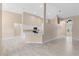Bright living room featuring soaring ceilings, neutral paint, and light-colored tile floors at 9885 Montclair Circle Cir, Apopka, FL 32703