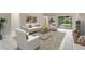 Comfortable living room with plush seating, stylish decor, and sliding glass doors to the backyard at 9885 Montclair Circle Cir, Apopka, FL 32703
