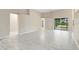 Spacious living room with an open floor plan and large sliding glass doors at 9885 Montclair Circle Cir, Apopka, FL 32703