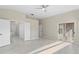 Spacious primary bedroom boasting tile floors, walk-in closets, and access to the lanai at 9885 Montclair Circle Cir, Apopka, FL 32703