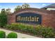 Community sign reads Montclair and is surrounded by lush landscaping at 9885 Montclair Circle Cir, Apopka, FL 32703