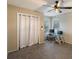 Neutral bedroom featuring carpet, a ceiling fan, natural light, and a closet with a curtain at 1010 Sugarberry Trl, Oviedo, FL 32765