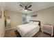 Cozy bedroom with a ceiling fan, dresser, window, ladder and nautical themed decor at 1010 Sugarberry Trl, Oviedo, FL 32765