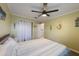 Bedroom featuring seaside decor, a ceiling fan, natural light and a closet with a curtain at 1010 Sugarberry Trl, Oviedo, FL 32765