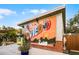Colorful mural on a building wall, showcasing the community's artistic spirit at 1010 Sugarberry Trl, Oviedo, FL 32765