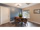 Cozy dining area featuring a wood table, chairs, and a window with natural light at 1010 Sugarberry Trl, Oviedo, FL 32765