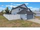 Exterior view of the home with an attached garage and a well-maintained yard at 1010 Sugarberry Trl, Oviedo, FL 32765