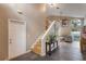 Inviting foyer with a staircase, gray tile flooring, and neutral-toned walls at 1010 Sugarberry Trl, Oviedo, FL 32765