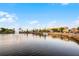 Beautiful lake view with a fountain, surrounded by waterfront shops and residences at 1010 Sugarberry Trl, Oviedo, FL 32765