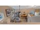 Open-concept floor plan boasts living room, dining area, and kitchen in a high-ceiling setting at 1010 Sugarberry Trl, Oviedo, FL 32765