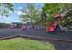 Vibrant playground area featuring slides, swings, and climbing frames for enjoyment at 1010 Sugarberry Trl, Oviedo, FL 32765