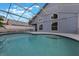 Screened-in pool with a covered lanai, offering a private and relaxing outdoor space at 1010 Sugarberry Trl, Oviedo, FL 32765