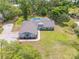 Aerial view of the single-story home that showcases the large lot size and beautiful in-ground pool at 106 Pine Tree Dr, Ormond Beach, FL 32174