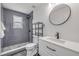 Modern bathroom with walk-in shower, sleek vanity, updated fixtures, and stylish tile work at 106 Pine Tree Dr, Ormond Beach, FL 32174