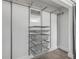 Walk-in closet with modern wire shelving, drawers and ample storage space at 106 Pine Tree Dr, Ormond Beach, FL 32174