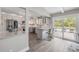 Updated kitchen with modern countertops, stainless appliances, and outdoor views of the pool at 106 Pine Tree Dr, Ormond Beach, FL 32174