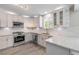 Modern kitchen with granite countertops, stainless steel appliances, and white subway tile backsplash at 106 Pine Tree Dr, Ormond Beach, FL 32174