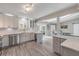 Bright updated kitchen with stainless steel appliances, quartz countertops, and an open layout to the breakfast nook at 106 Pine Tree Dr, Ormond Beach, FL 32174