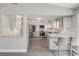 Spacious kitchen with stainless steel appliances, white cabinetry, and stone countertops at 106 Pine Tree Dr, Ormond Beach, FL 32174