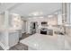 A gourmet kitchen featuring stone countertops, stainless steel appliances, and modern cabinetry at 106 Pine Tree Dr, Ormond Beach, FL 32174