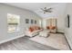 Inviting living room featuring vaulted ceilings, neutral decor, ample natural light, and luxury vinyl plank flooring at 106 Pine Tree Dr, Ormond Beach, FL 32174