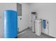 Spacious utility room featuring water softener and tank at 106 Pine Tree Dr, Ormond Beach, FL 32174