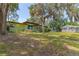 Charming green single-Gathering home with large, mature trees in a peaceful residential neighborhood at 1108 Gibson St, Leesburg, FL 34748
